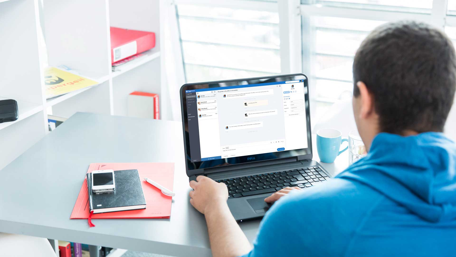 Man working from home on laptop using TeamViewer Servicecamp